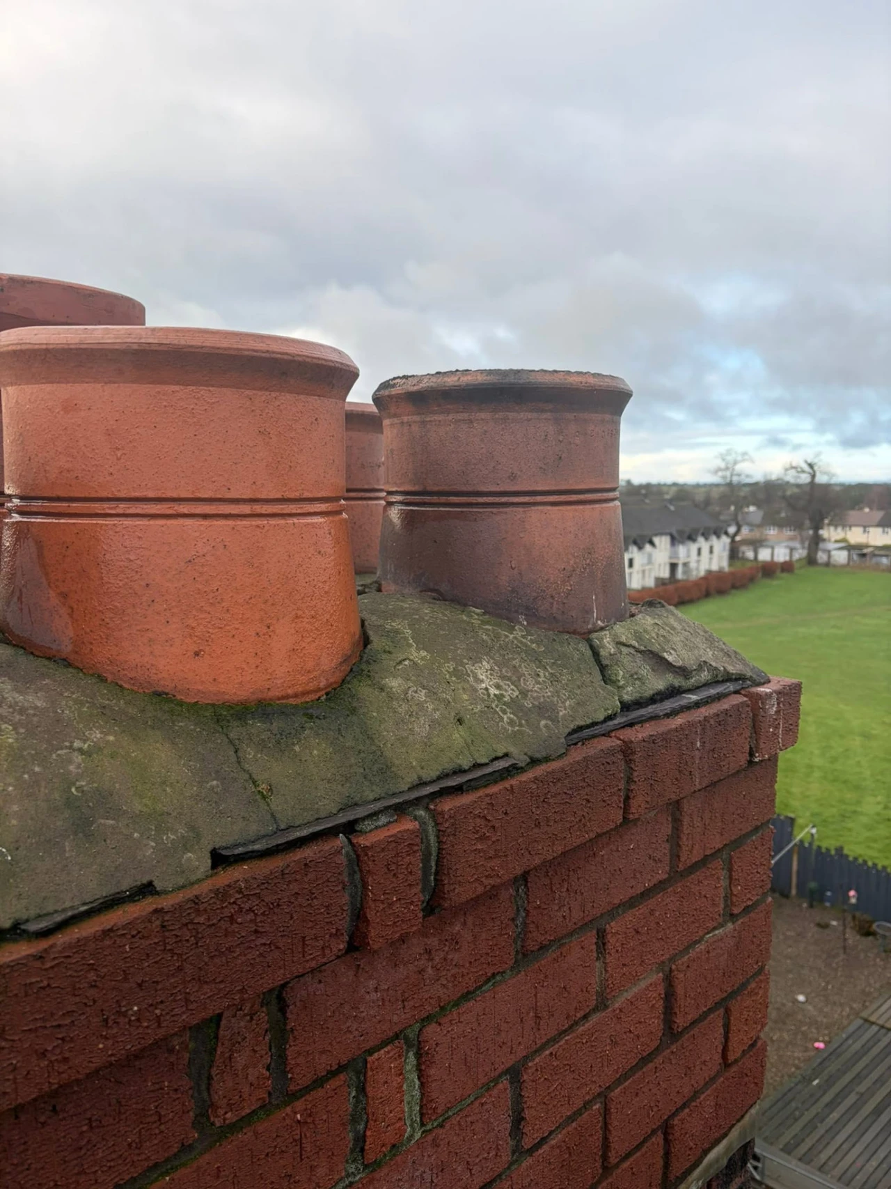 Chimney pots and deteriorated flaunching before work