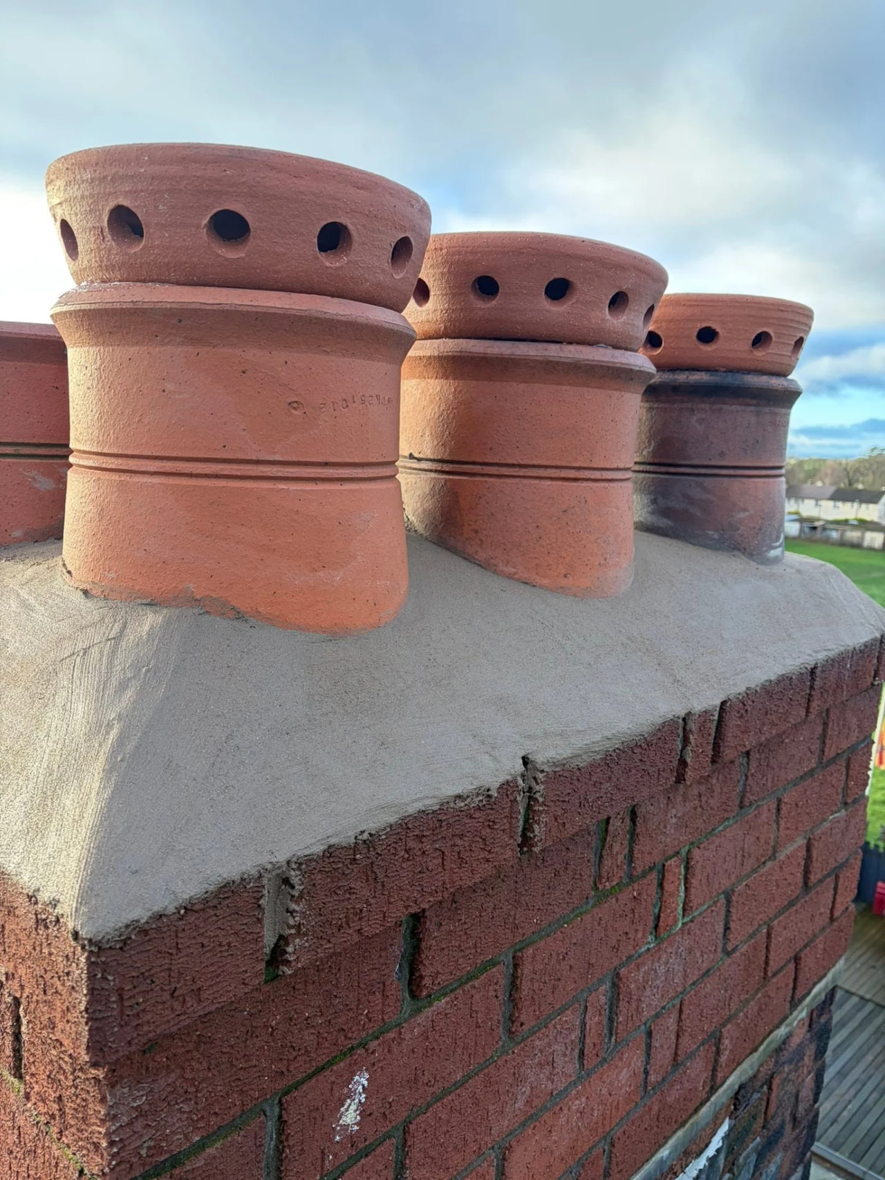 Chimney pots and renewed flaunching after work